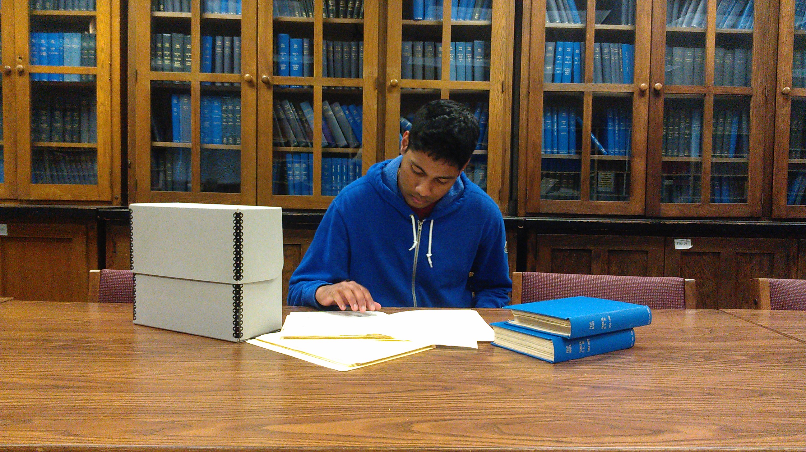 Ajay Yalamanchi working on the Charles S. Thaeler, Jr. papers